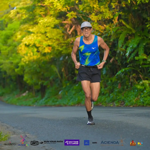 Coach Ige Lopez charging up the hills at Spectra Run 2026