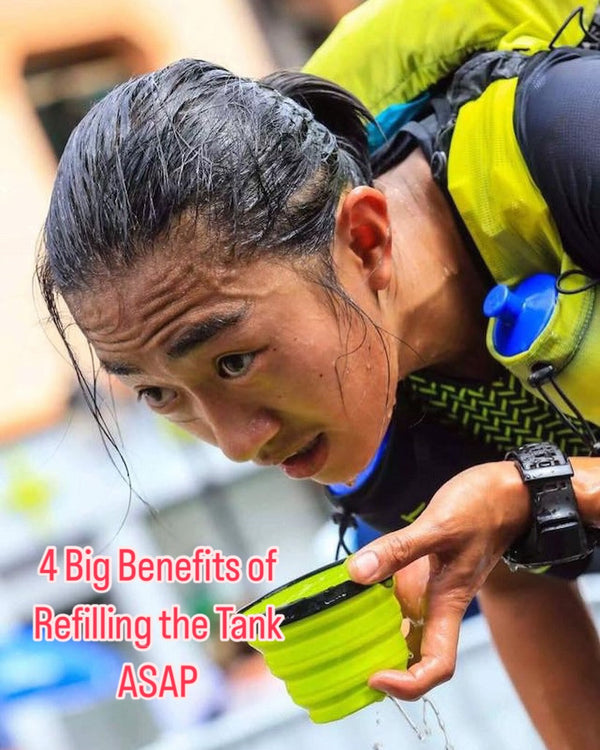 Athlete refuelling at an aid station, 4 Big Benefits of Refilling the Tank ASAP