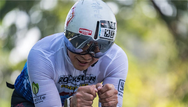 Coach Reujen Lista on the aero bars with Hammer Nutrition on his helmet