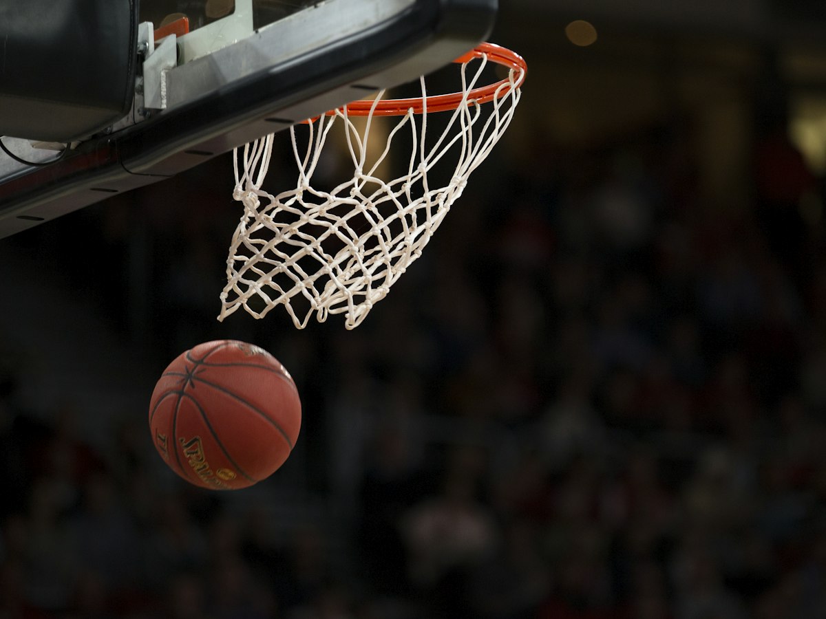 Basketball dropping through the hoop