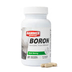 A white bottle of Hammer Nutrition Boron dietary supplement with three beige capsules in the foreground, set against a plain white background.