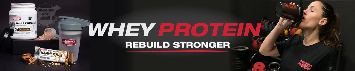 A promotional banner for Whey Protein featuring a woman on the right drinking from a shaker cup, alongside product images on the left including a tub of protein powder, a shaker bottle, a scoop, and a protein bar. Large text reads 'WHEY PROTEIN' with 'REBUILD STRONGER' underneath.