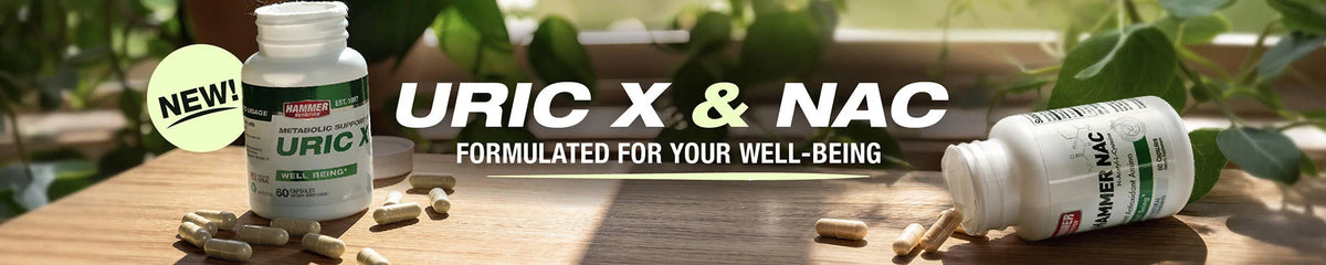 Two white supplement bottles labeled URIC X & NAC with capsules scattered on a wooden surface, set against a blurred natural background with green leaves. Large text reads 'URIC X & NAC' and 'FORMULATED FOR YOUR WELL-BEING'.